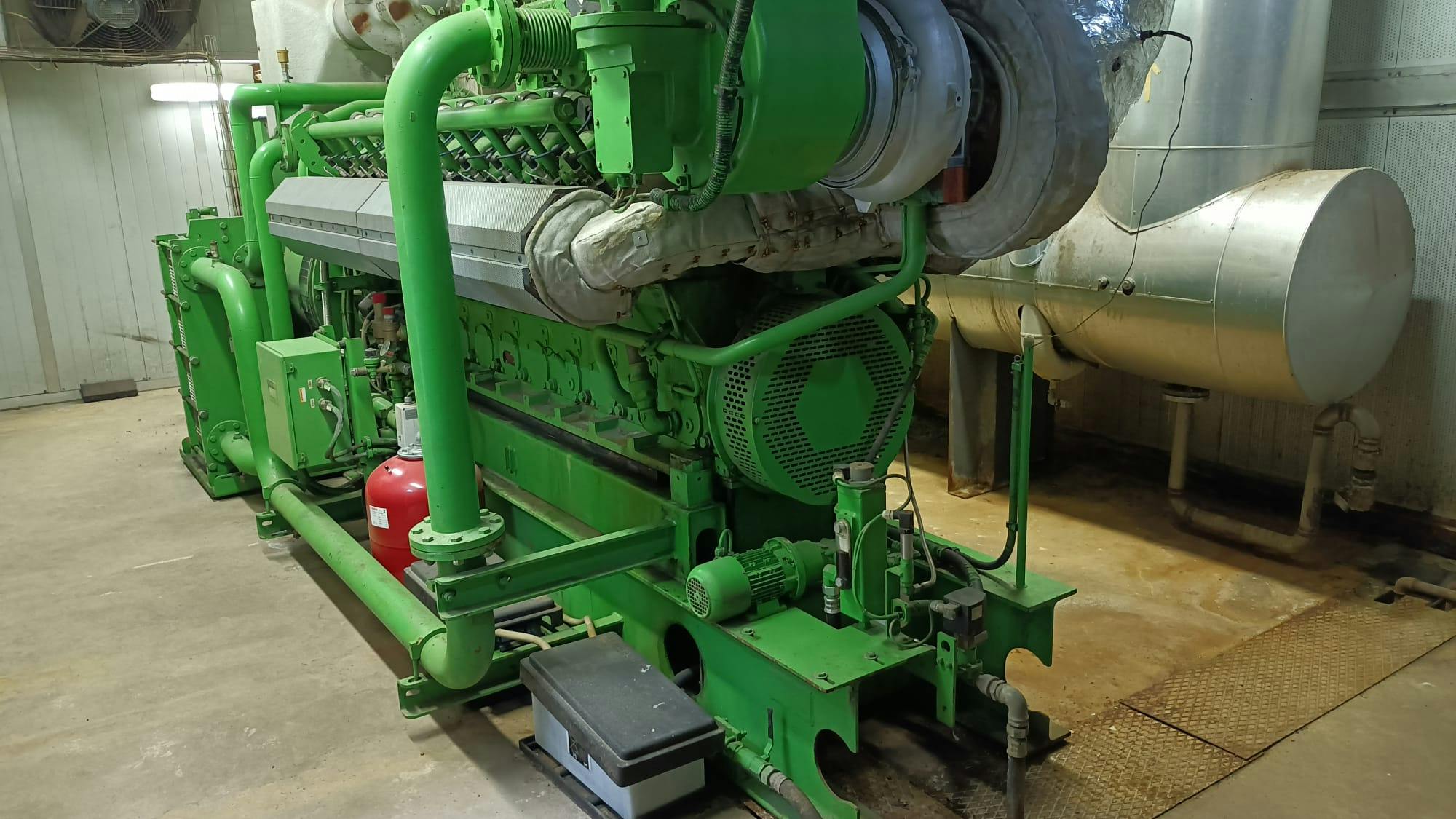nullPhoto of Jenbacher 320 G.S N-L Natural Gas Generator Set showing gas engine and gas line - used gas generator