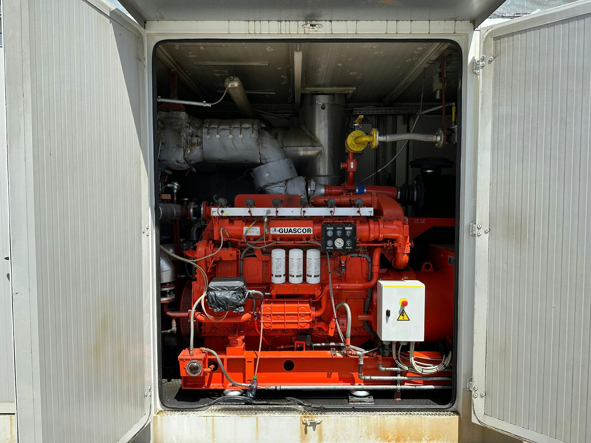 nullPhoto of Guascor FGLD180 Natural Gas Generator Set showing doors opening to inside of generator - gas generator for sale uk used